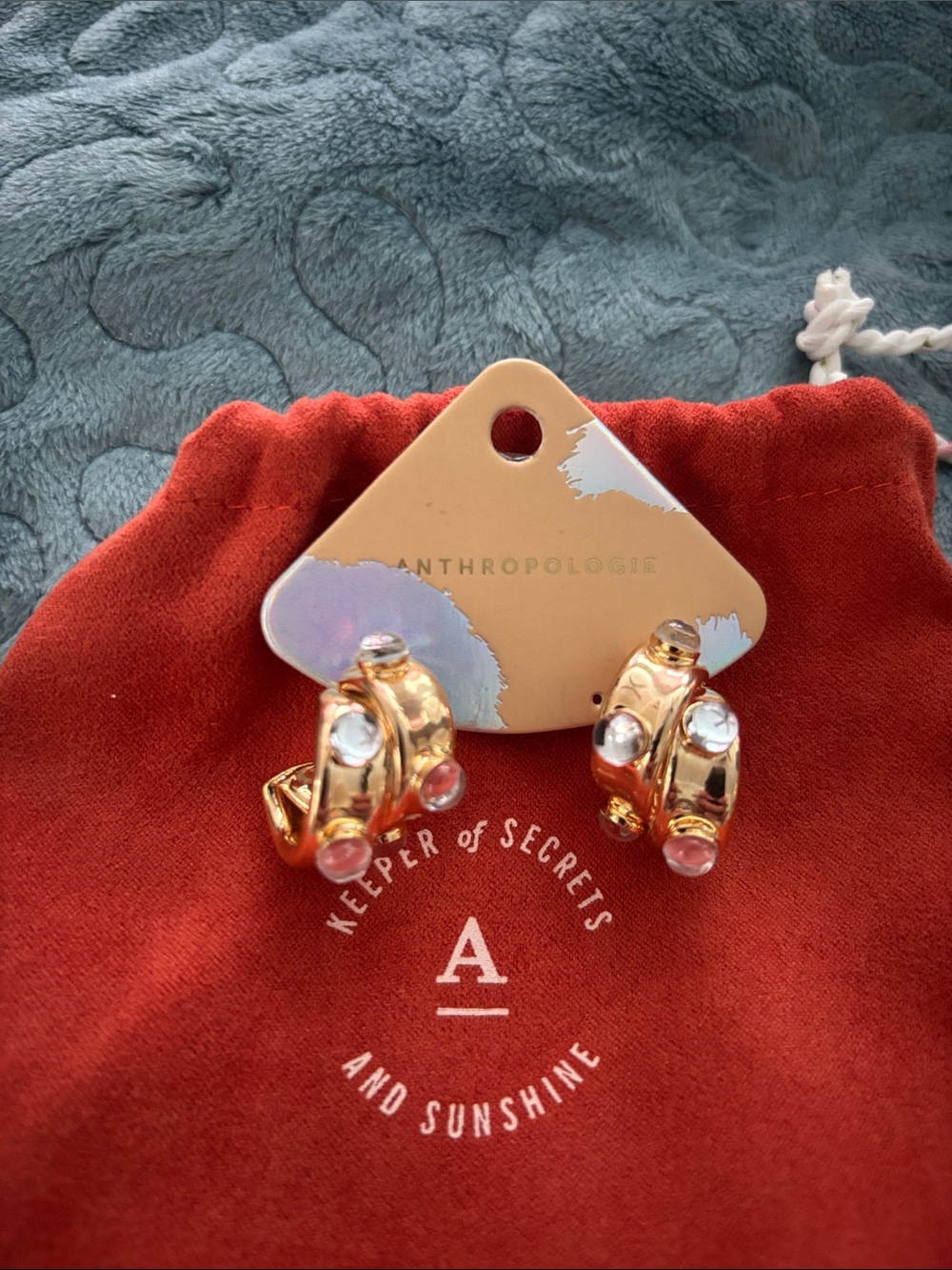 Anthropologie stone.curved earrings with clear stones,